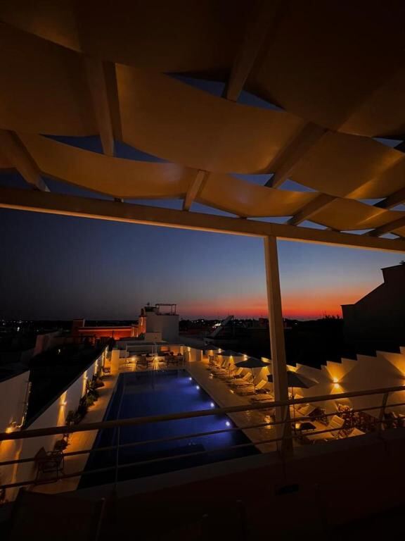 Rooftop pool terrace at sunset at Zahra Superior Suite, Salento